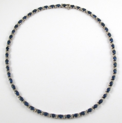 Appraisal: SAPPHIRE AND FOURTEEN KARAT WHITE GOLD NECKLACE set with oval-cut