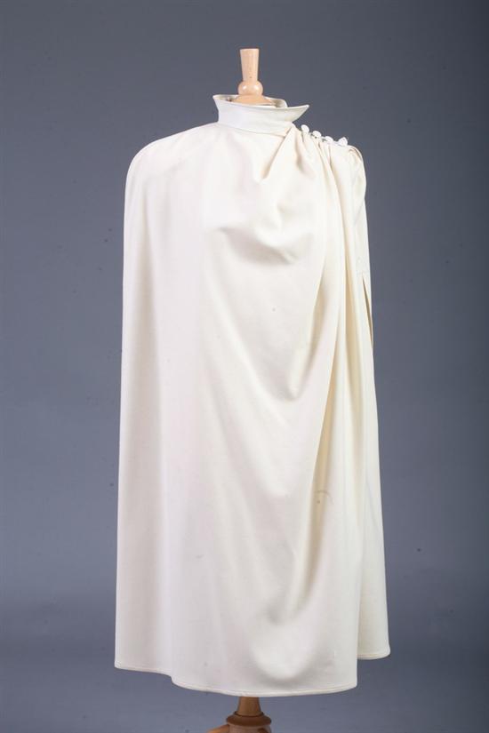 Appraisal: GILL Y JACQUES CREAM WOOL AND LEATHER-TRIMMED CAPE Full-length five