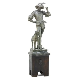 Appraisal: CONTINENTAL BRONZE COURT FIGURE Standing figure with dog companion on