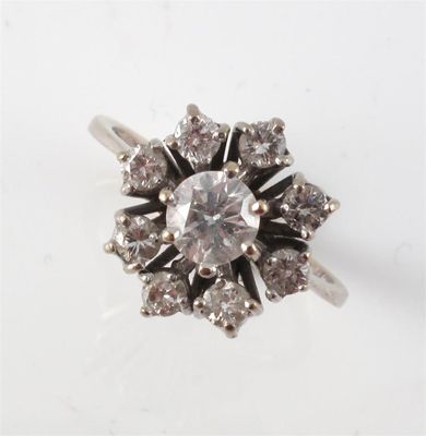 Appraisal: A diamond cluster ring Centered with a circular cut diamond