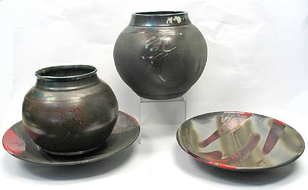 Appraisal: Two art pottery jars and two chargers attributed to Evans