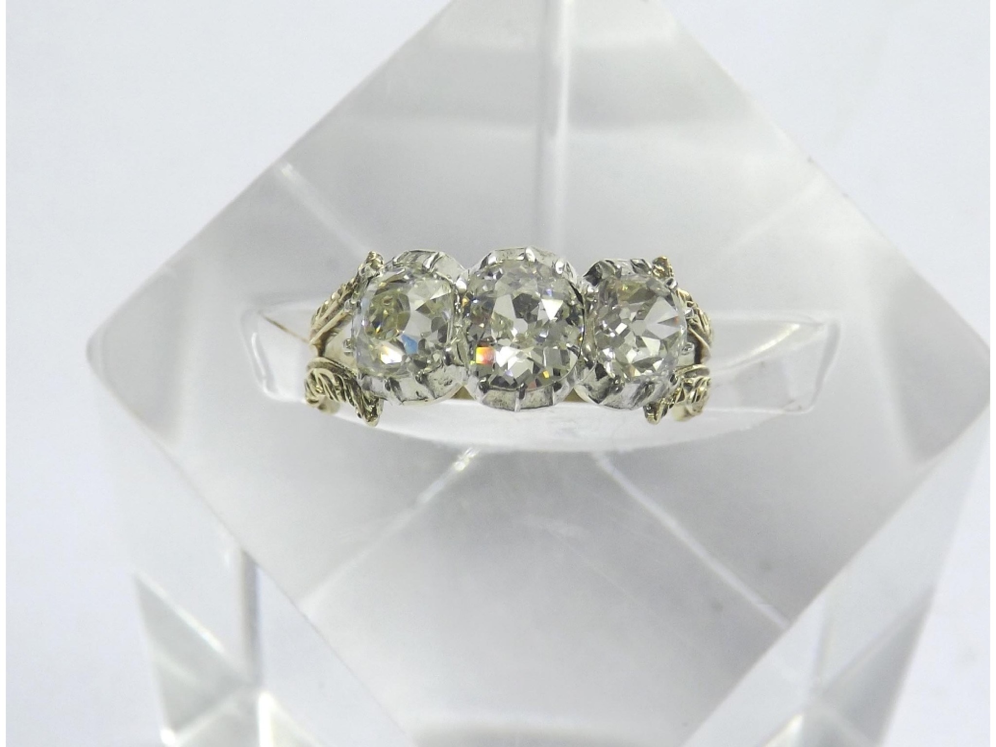 Appraisal: Fine Victorian cushion-cut rub-over diamond three stone ring set in