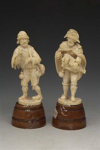 Appraisal: A PAIR OF TH CENTURY CONTINENTAL IVORY FIGURES Hurdy Gurdy