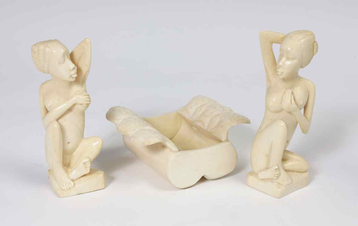 Appraisal: PIECE AFRICAN CARVED IVORY To include seated nude female figure