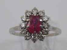 Appraisal: A white metal tests ct gold ruby and diamond ring