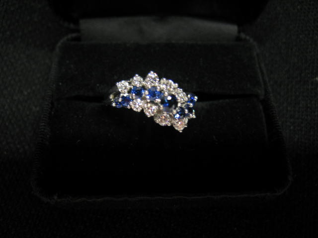 Appraisal: Sapphire Diamond Ring round deep blue sapphires totaling carats and