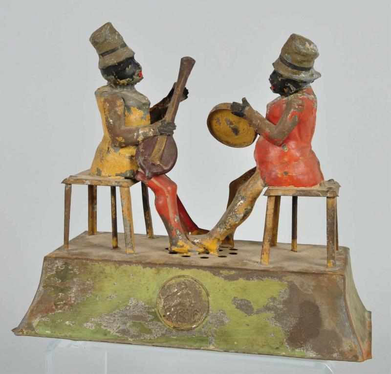 Appraisal: Tin Gunthermann Musician Clockwork Toy Description German Emits plink plink