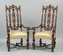 Appraisal: A Pair of Elaborately Carved Walnut Wood Armchairs A pair