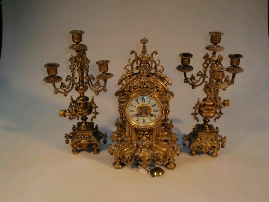 Appraisal: A thC French gilt brass clock garniture of eight-day movement