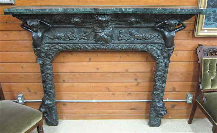 Appraisal: RENAISSANCE STYLE CAST BRONZE FIREPLACE SURROUND with rectangular verde marble