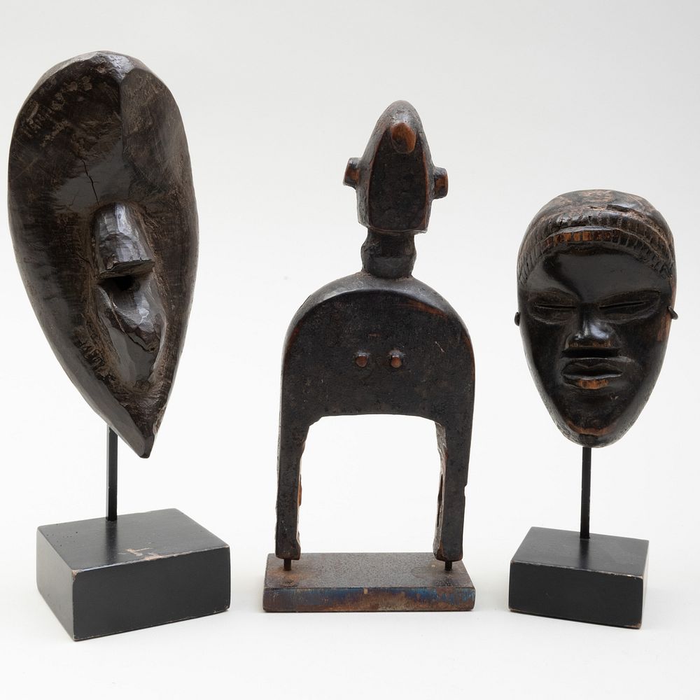 Appraisal: Ivory Coast Wooden Passport Mask Dan Raised on stand together