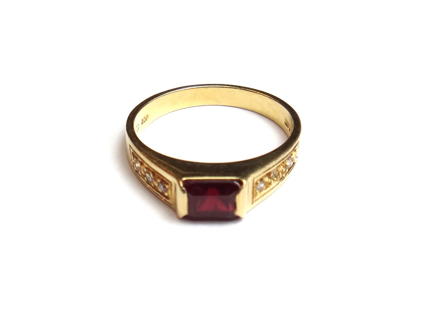 Appraisal: An ct gold ring mounted with a rectangular step cut