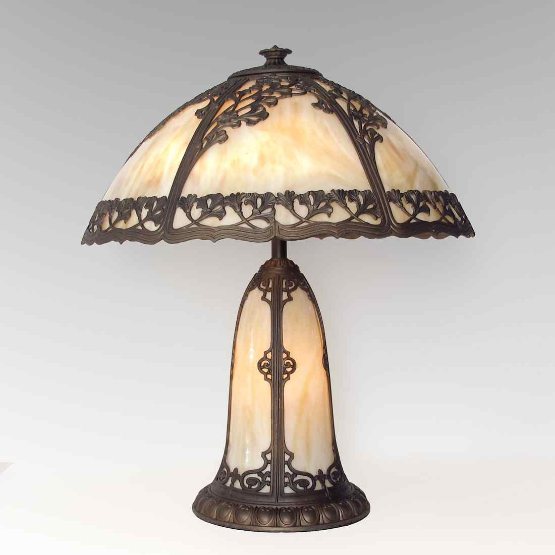 Appraisal: EMPIRE VINTAGE FILIGREE TABLE LAMP WITH LIGHTED BASE panel domed