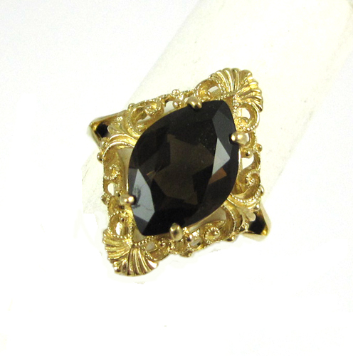 Appraisal: SMOKY QUARTZ AND TEN KARAT GOLD RING set with a