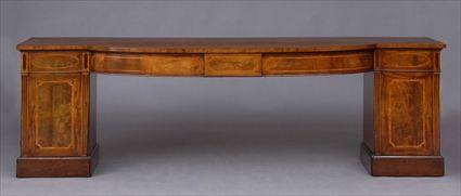 Appraisal: GEORGE III INLAID MAHOGANY TWO-PEDESTAL SIDEBOARD The bowed breakfront cross-banded