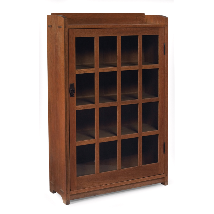 Appraisal: Gustav Stickley bookcase single door with sixteen divided panes and