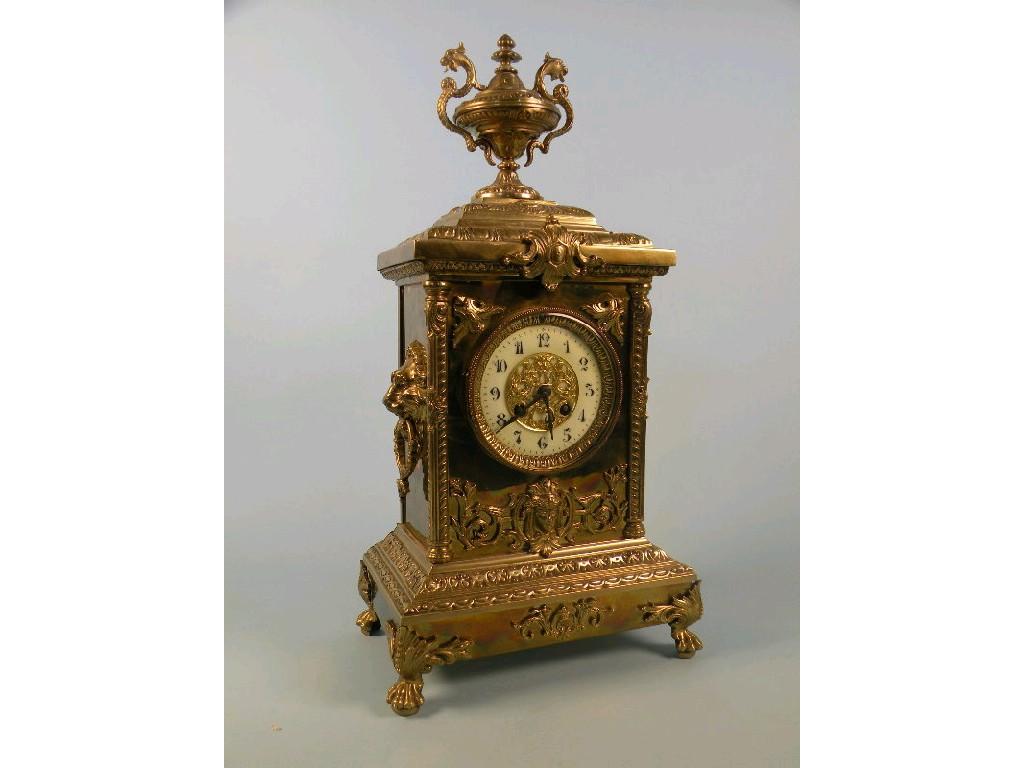 Appraisal: A thC Continental brass mantel clock the case cast with