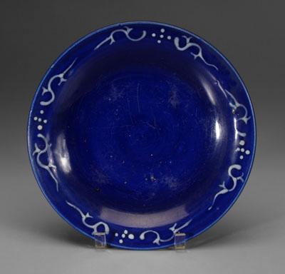 Appraisal: Chinese blue-ground shallow bowl white slip decoration of scrolling vines