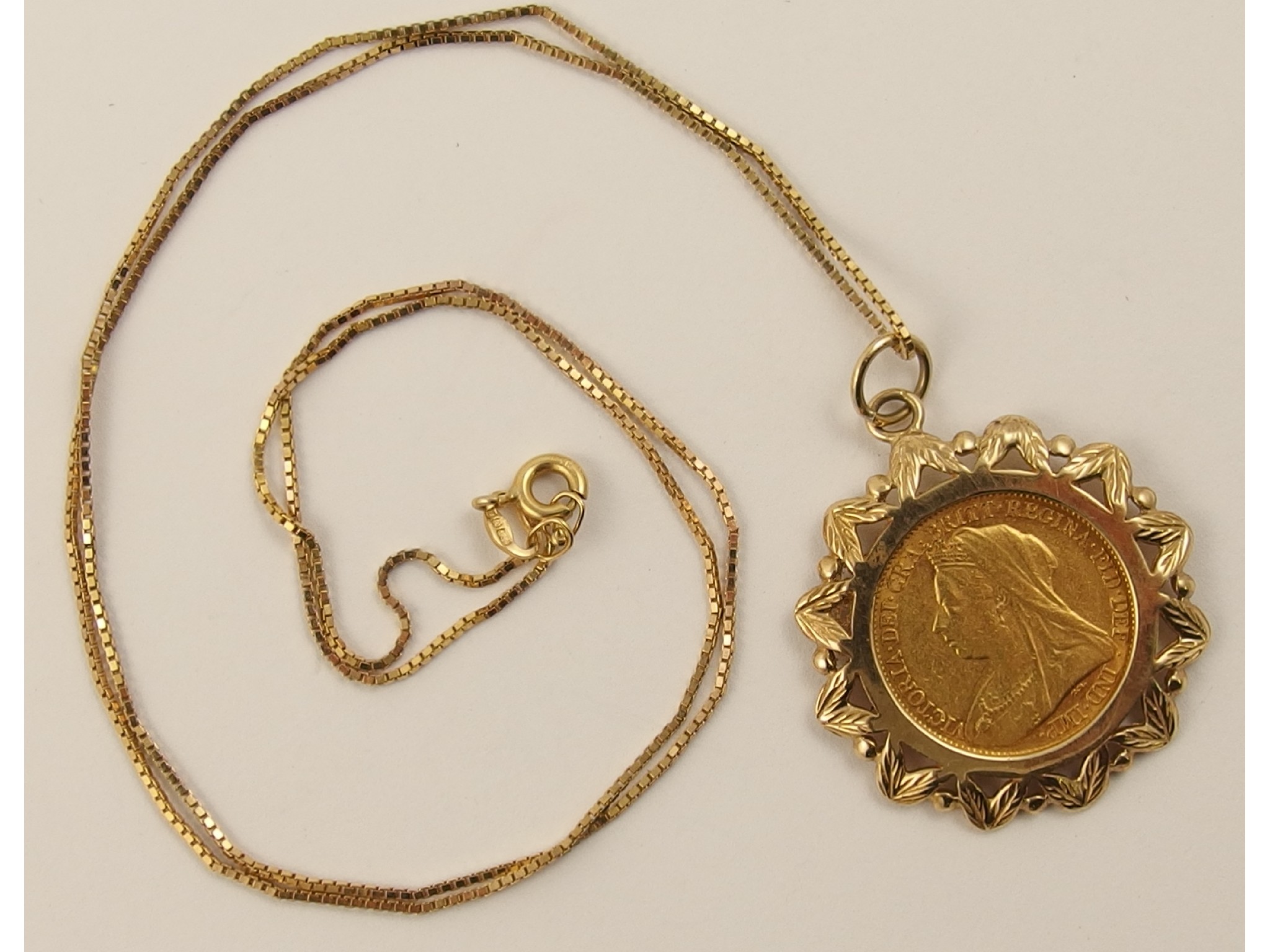 Appraisal: A half sovereign in ct mount with ct chain weight