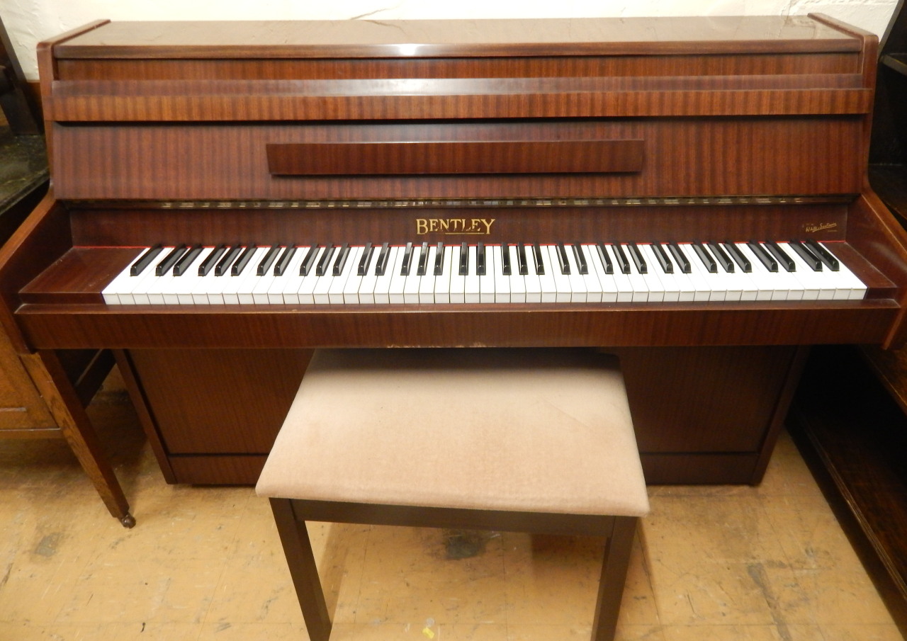 Appraisal: A Bentley low upright piano cm wide and a stoolThe