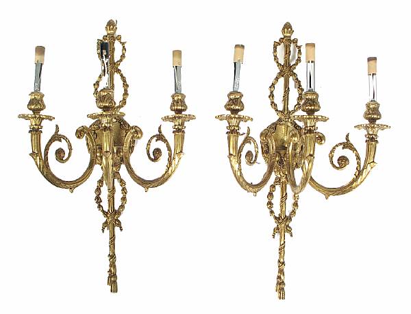 Appraisal: A pair of gilt bronze three light wall sconces height