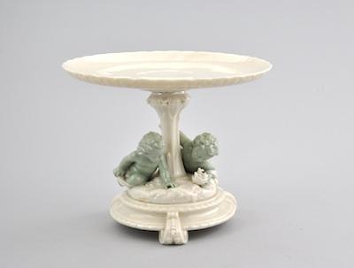 Appraisal: A Beautiful Porcelain Cake Stand with Cherubs Cream color cake