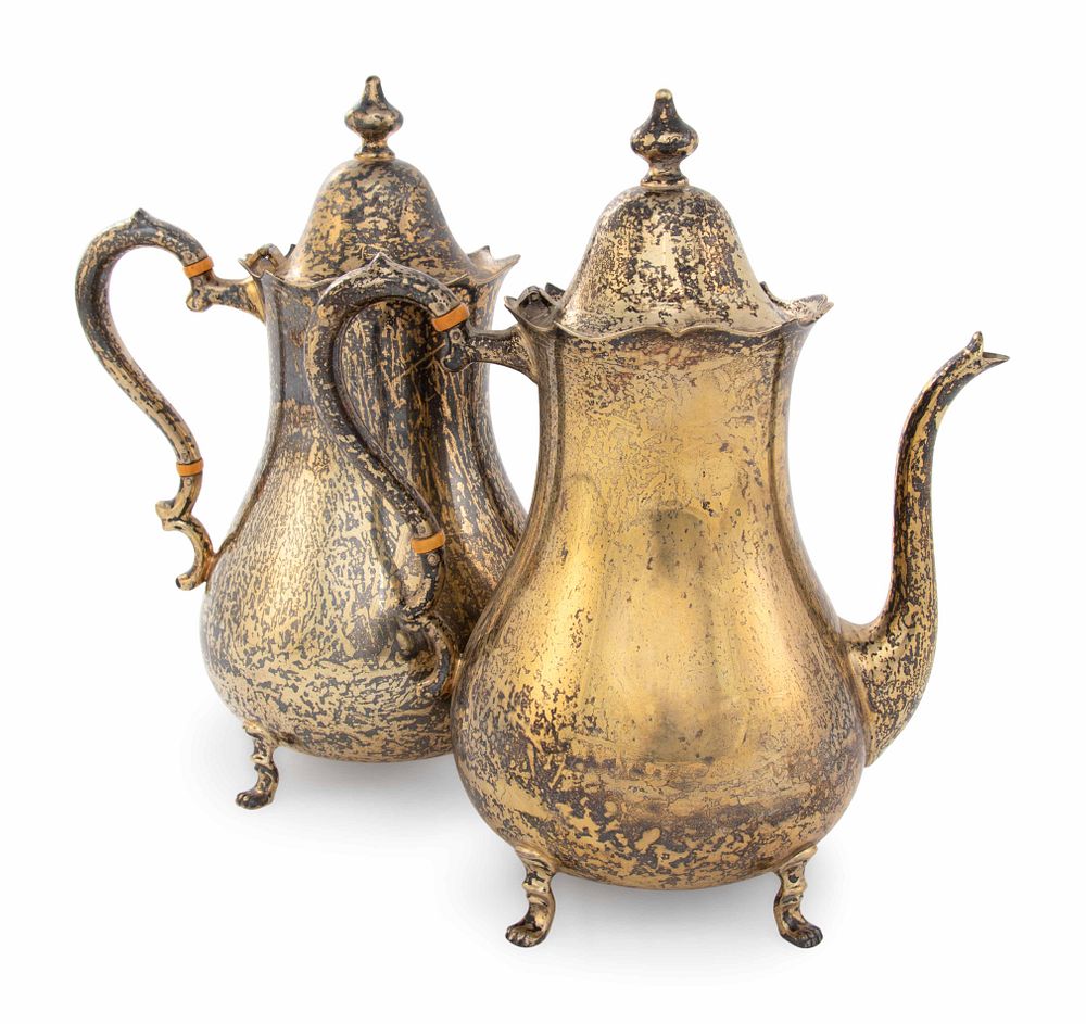 Appraisal: A Pair of Cartier Silver-Gilt Teapots A Pair of Cartier