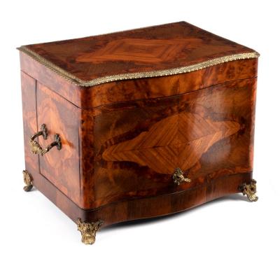 Appraisal: A Victorian walnut and inlaid decanter box the serpentine front