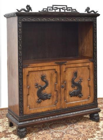 Appraisal: Chinese mixed wood cabinet th c carved crest with fretwork