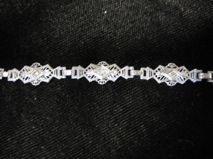 Appraisal: White gold and diamond filigree braceletin the style of art