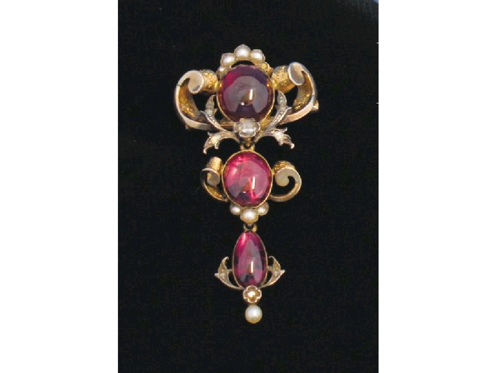 Appraisal: A VICTORIAN GARNET-SET BROOCH the central carbuncle garnet surrounded by