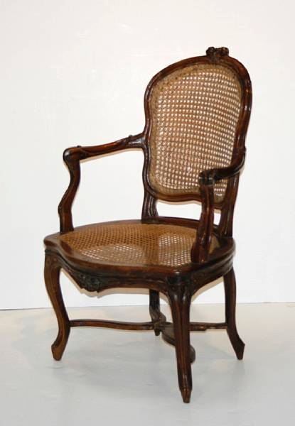 Appraisal: A Louis XV Provincial walnut and caned fauteuil third quarter