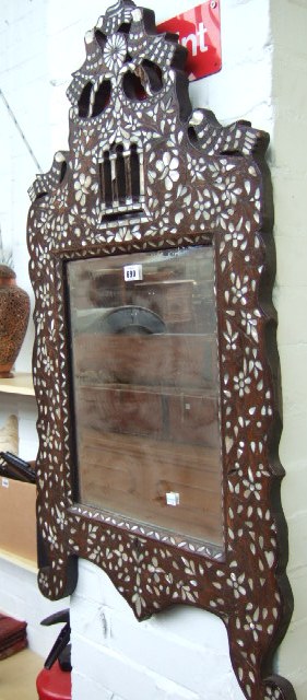 Appraisal: A Syrian hardwood and mother of pearl inlaid hanging wall