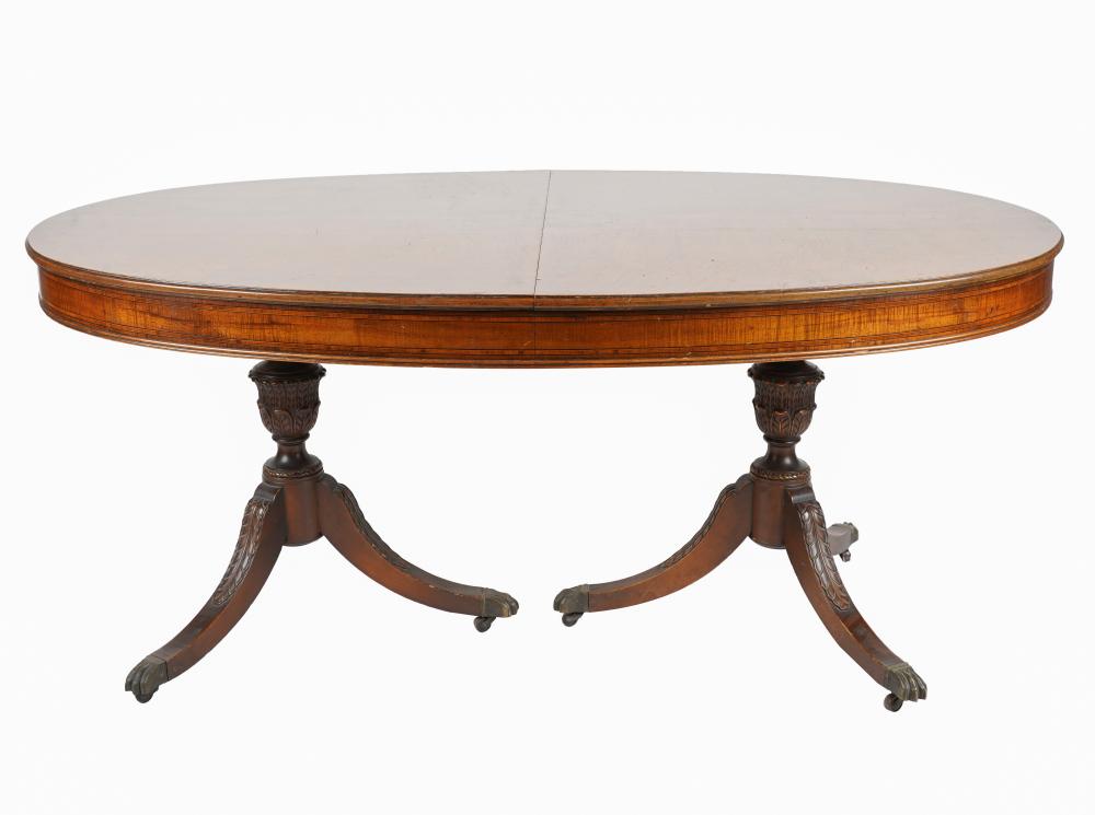 Appraisal: ENGLISH PEDESTAL DINING TABLEhaving an oval top with central marquetry-inlaid