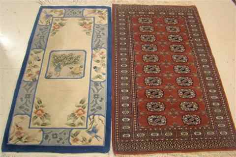 Appraisal: TWO RUGS CHINESE BLUE CREAM SCULPTURED WOOL RUNNER approx '