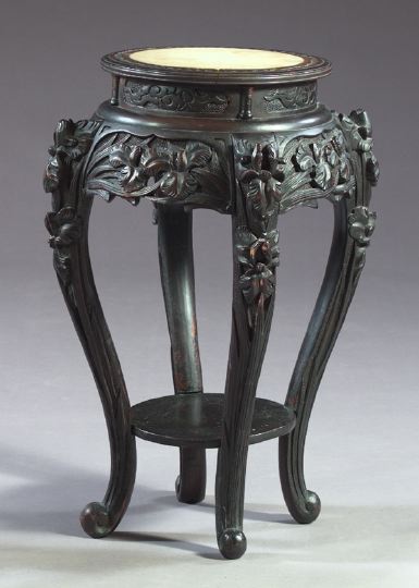 Appraisal: Asian Ebonized Hardwood Iris-Carved Circular Plant Stand with a molded