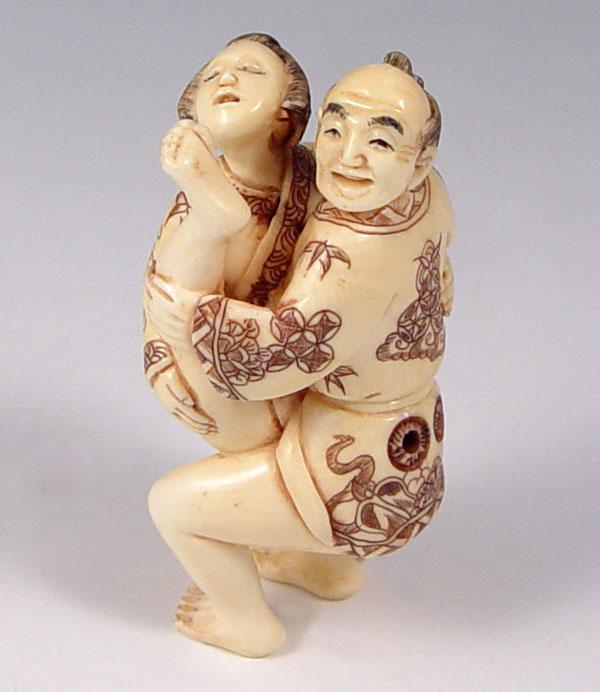 Appraisal: CARVED IVORY EROTIC NETSUKE Graphic erotic with figures Signed in