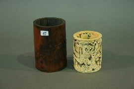 Appraisal: A bamboo brush pot carved with a figural scene with