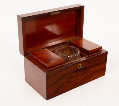 Appraisal: A George III mahogany tea caddy with two compartments and