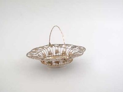 Appraisal: An early George III wire work sweetmeat basket shaped with