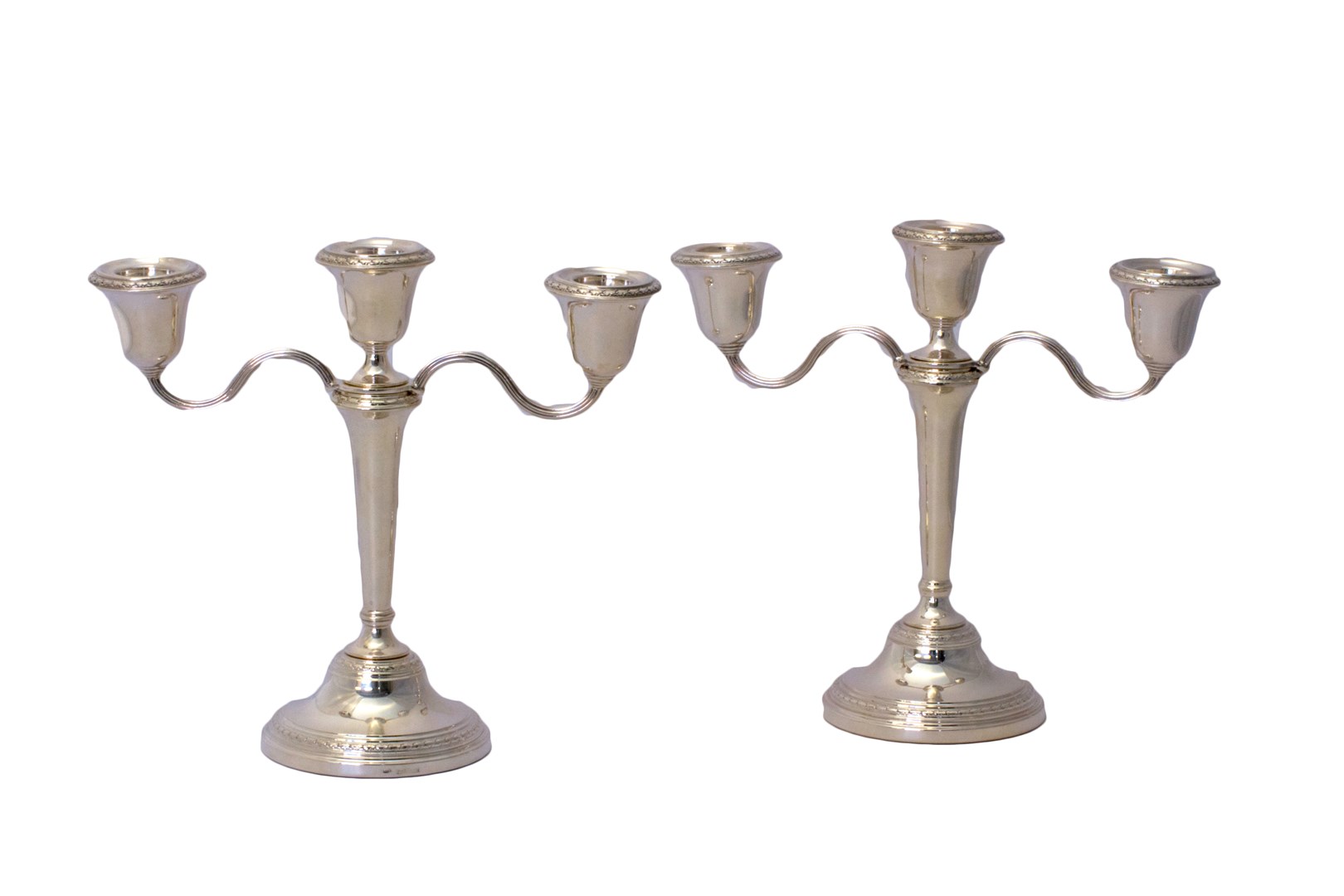 Appraisal: A pair of silver three light table candelabra each with