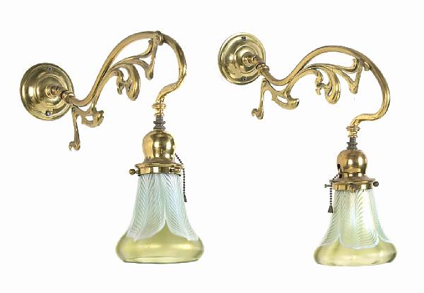 Appraisal: A pair of Art Nouveau brass single light sconces with