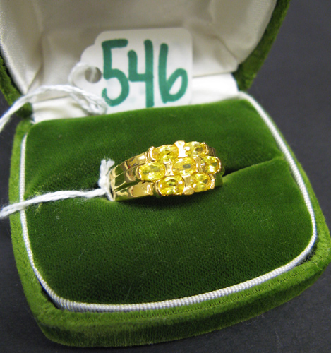 Appraisal: CITRINE AND TEN KARAT GOLD RING set with seven oval-cut