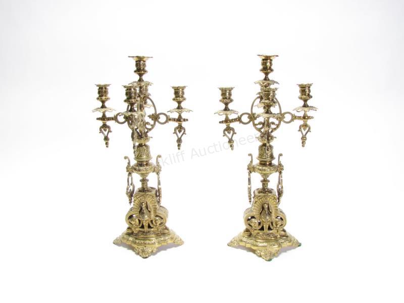 Appraisal: A pair of five-light candelabra brass with peacock figures on