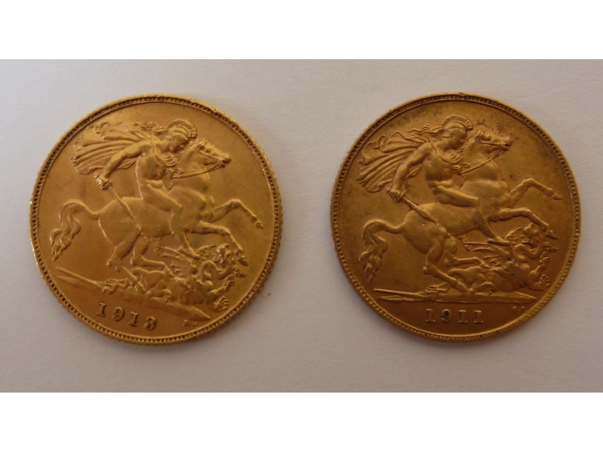 Appraisal: TWO GEORGE V GOLD HALF-SOVEREIGNS and