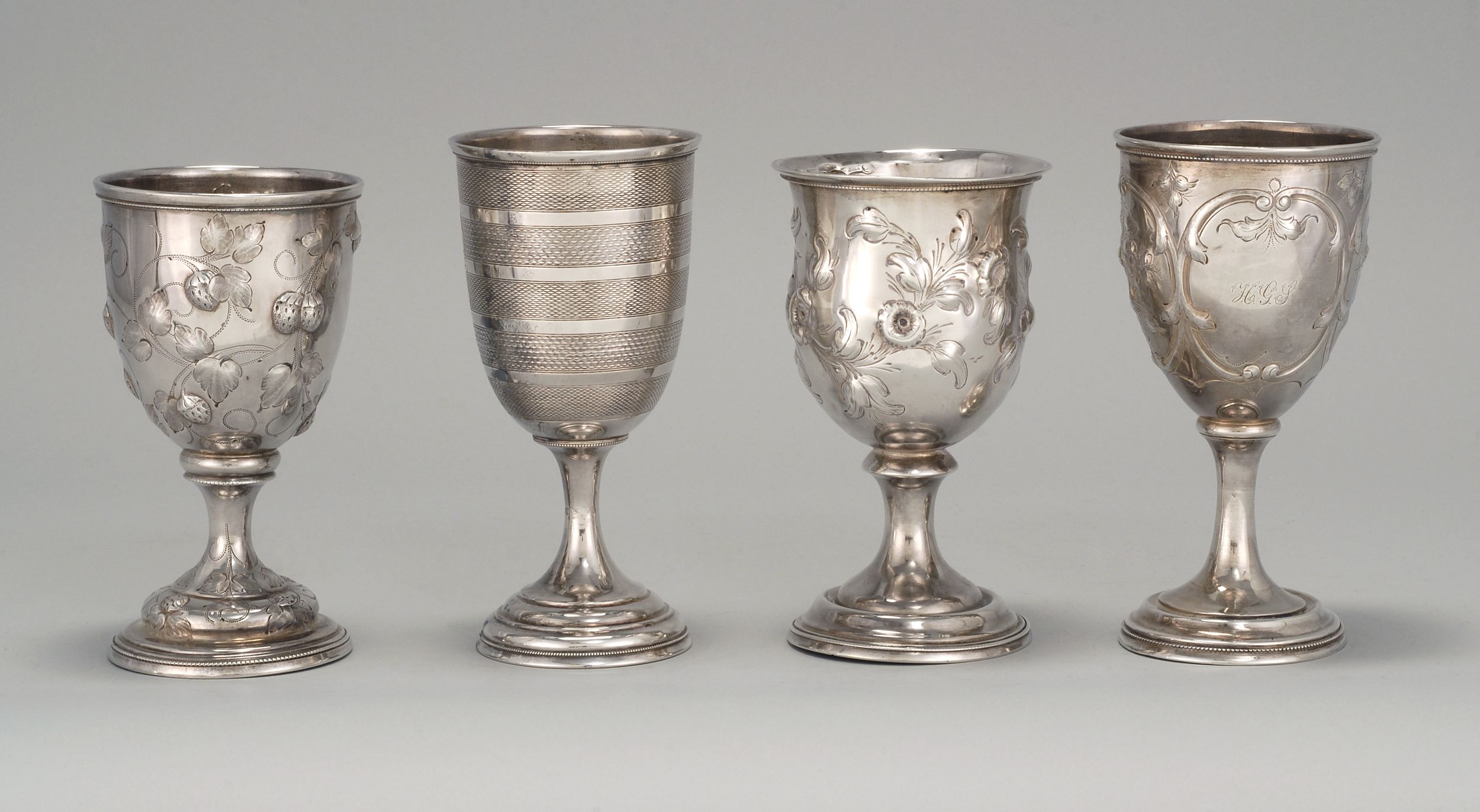 Appraisal: FOUR AMERICAN SILVER GOBLETS Mid- th CenturyThree with chased designs