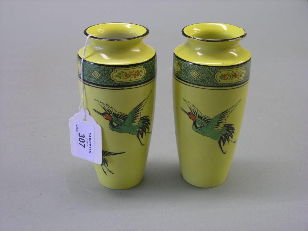 Appraisal: A pair of Shelley vases printed and enamelled with exotic