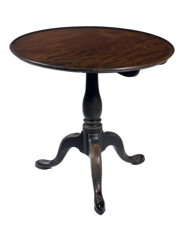 Appraisal: A GEORGE III MAHOGANY TRIPOD TABLE the dished circular top