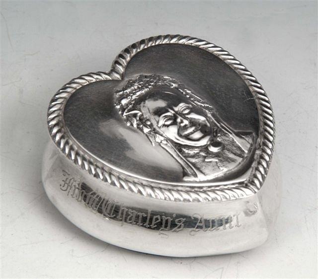 Appraisal: A HEART SHAPED SILVER BOX the lid embossed with a