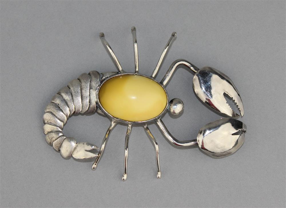 Appraisal: SILVER SCORPION BROOCH WITH GOLDEN YELLOW CABOCHON BODY the brooch